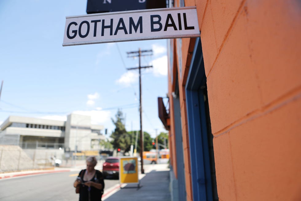 A sign advertises a bail bond company located near two jails in Los Angeles.  California was the first state to abolish cash bail for suspects who are awaiting trial.