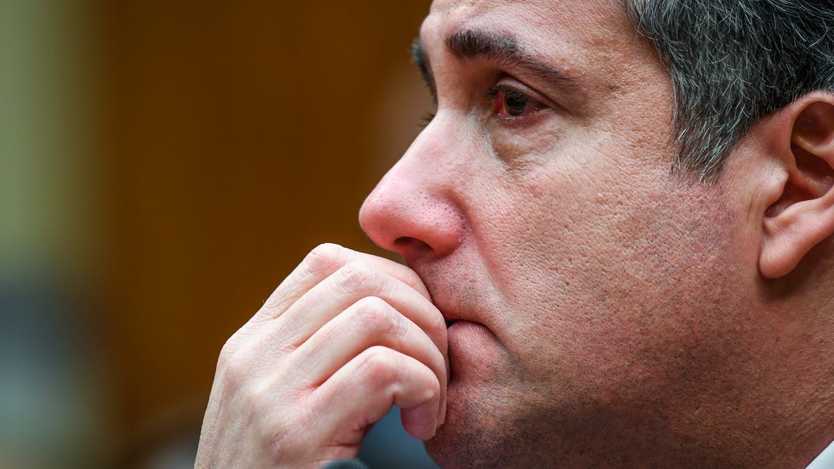 Michael Cohen, President Donald Trump's longtime personal attorney, is near tears listening to closing remarks by House Oversight and Reform Chairman Elijah E. Cummings at the conclusion of the House Committee on Oversight and Reform on Feb. 27, 2019 in Washington. Cohen was sentenced to three years in prison for a series of federal crimes, including campaign finance violations and tax evasion. 