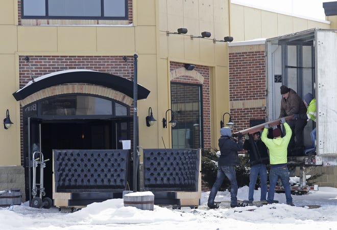 Workers remove furniture from the former Parma restaurant in Grand Chute. The location, 3775 W. College Ave., is the future site of a Chick-fil-A restaurant.