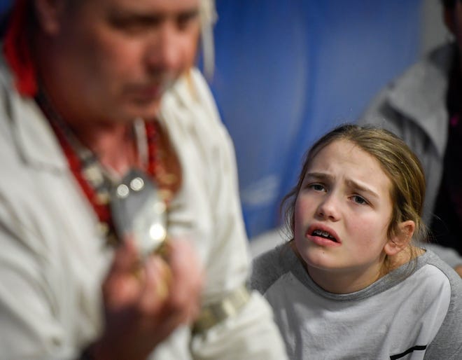 East Heights Elementary school fifth grader Averi York, 10 years-old, reacts as she listens to how Native Americans created tattoos during a program sponsored by the Henderson Area Arts Alliance Wednesday, February 27, 2019.