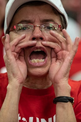 JCTA instructor Karen Schwartz cheers as Kentucky teachers await the start of the hearing for House Bill 525 at the Kentucky Capitol on Thursday. Feb. 28, 2019