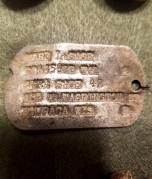 This World War II dog tag belonging to Ward Lee Sage of Wisconsin was found last year by a treasure hunter in Brisbane, Australia. The tag was returned in February to Sage's grandson, Brian Eft, of Elm Grove.