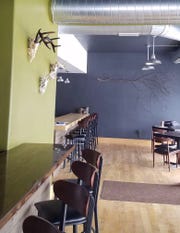 The decor at Wild Roots, which is to open soon at 6807 W. Becher St. in West Allis, suggests its connection to nature and the seasons, such as the deer antlers on one wall and an apple tree branch on another.