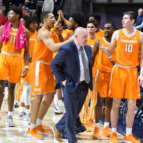 Tennessee Volunteers players react after...