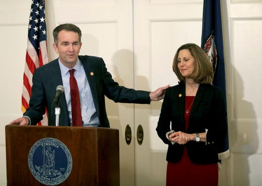 Virginia Gov. Ralph Northam, left, with his wife Pam at his side, speaks during a press conference in the Executive Mansion on Saturday, Feb. 2, 2019.  Northam is under fire for a racial photo that appeared in his college yearbook.
