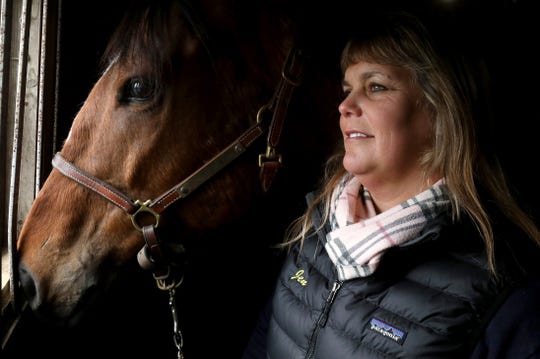 Jennifer Blades, the owner and operator of Willowbrooke Farms in Plymouth poses for a portrait with Warrior Inside, a former race horse on Tuesday, February 5, 2019. The farm caters towards retired race horses enrolled in the Canter USA program which rehabs, retrains and finds new homes for thoroughbreds who leave racing at young ages when they become injured or are not fast enough to win.


.