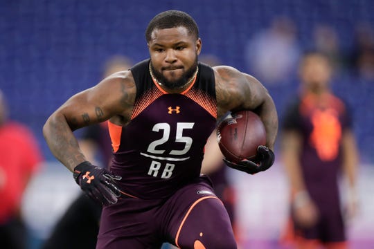 Ohio State running back Mike Weber runs a drill at the NFL Combine on Friday.
