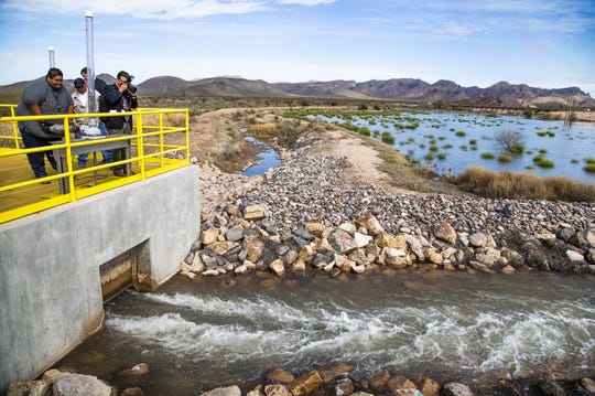 Water is ceremoniously released at the MAR 5 Interpretive Trail grand opening ceremony near Sacaton, Friday, March 1, 2019.