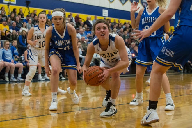 West Central's Kali Nelson (12) dribbles the ball past Garretson players during a game, Thursday, Feb. 28, 2019 in Tea, S.D.