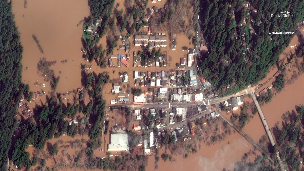 This Thursday, Feb. 28, 2019 satellite image provided by DigitalGlobe shows The Russian River flooding Guerneville, Calif.