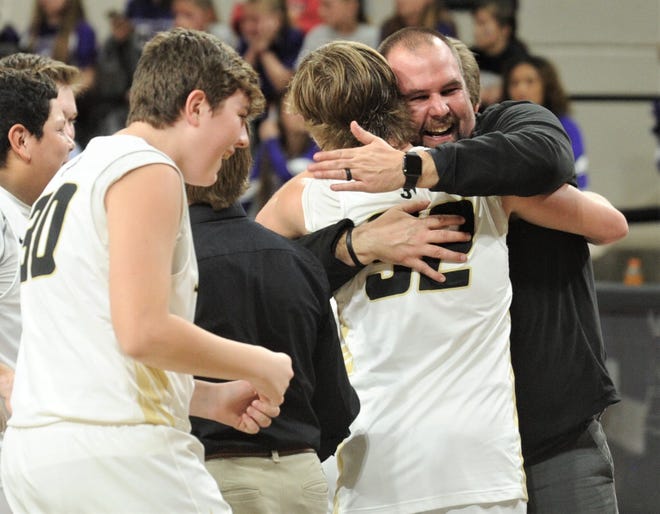 Jayton assistant coach Josh Stanaland, right, hugs Tye Scogin after the Jaybirds beat Irion County 47-32 in the Region II-1A championship game Saturday, March 2, 2019, at Abilene Christian's Moody Coliseum. It's Jayton's first state berth.