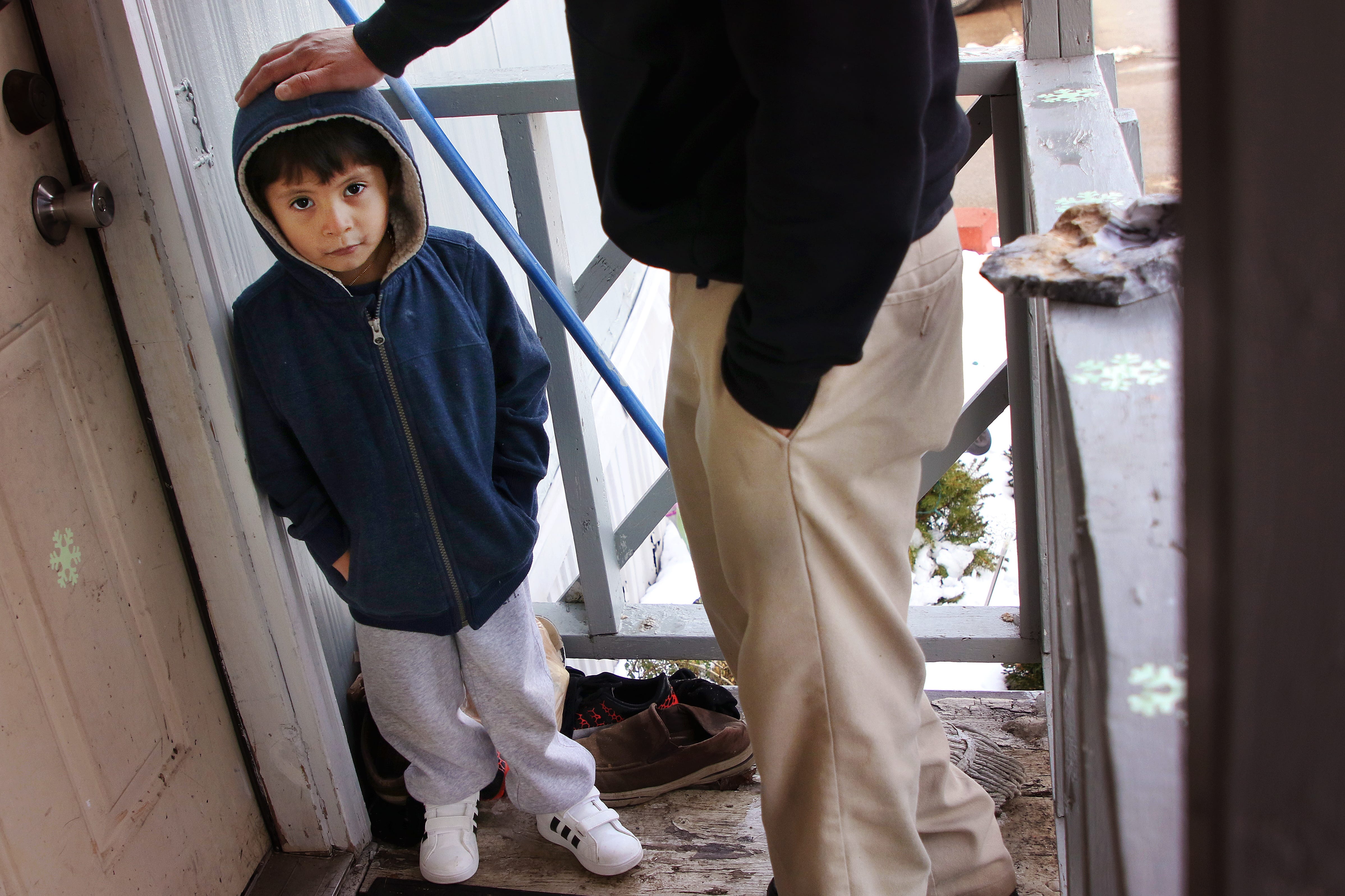 Francisco Ramirez and his 3-year-old son, Roberto, live in a mobile home park. Ramirez and his wife have four children. The family shares two bedrooms.