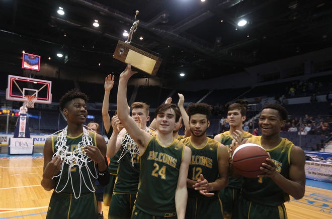C.G. Finney's Keegan Ocorr (24) and teammates celebrate winning the Class C1 title 63-42 over Marcus Whitman. 