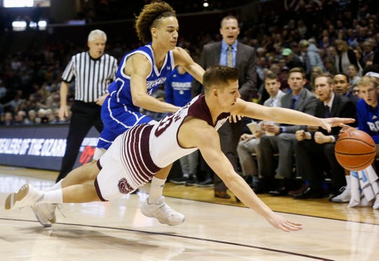 Ryan Kreklow dives after the ball during the Missouri State game against Drake at JQH Arena on Saturday, Mar. 2, 2019.