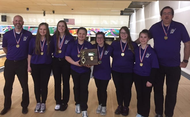 The Lexington girls bowling team shows off its hardware after winning a district championship Saturday at Star Lanes in Port Clinton.