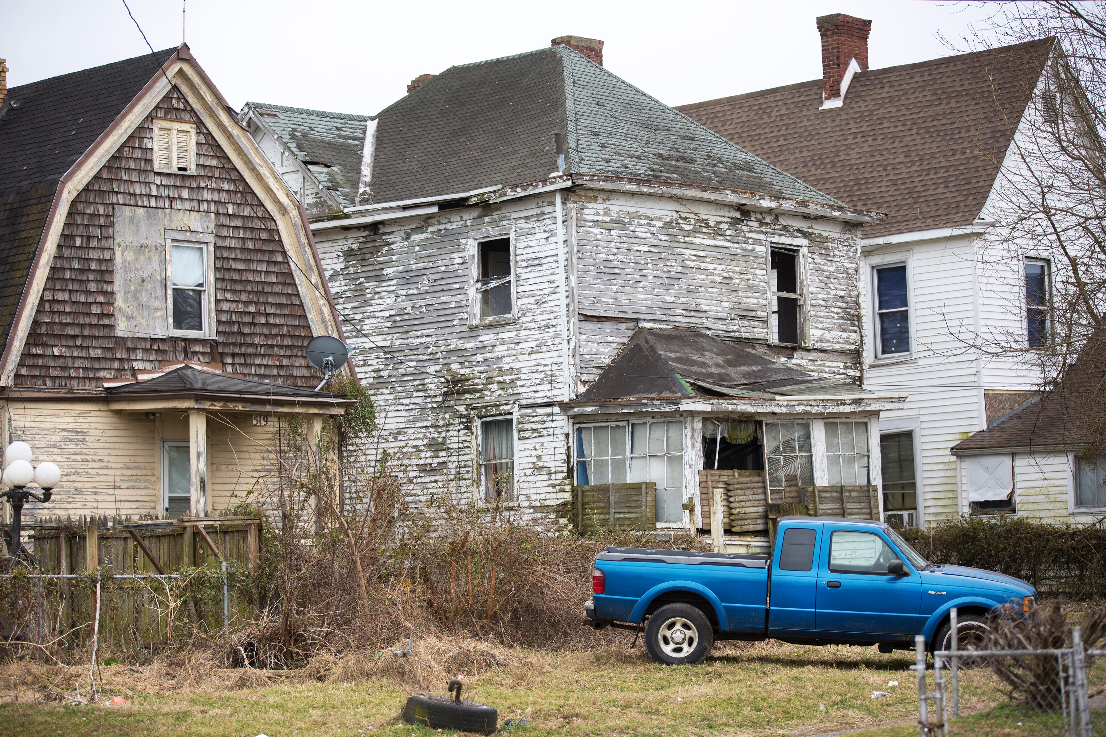 Many homes look abandoned and boarded up in low-income neighborhoods throughout Portsmouth.