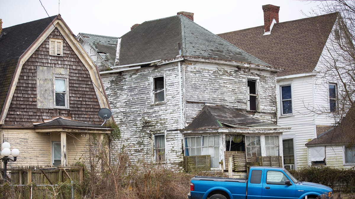 A low income neighborhood in Portsmouth, Ohio. Several of the homes are abandoned and boarded up.