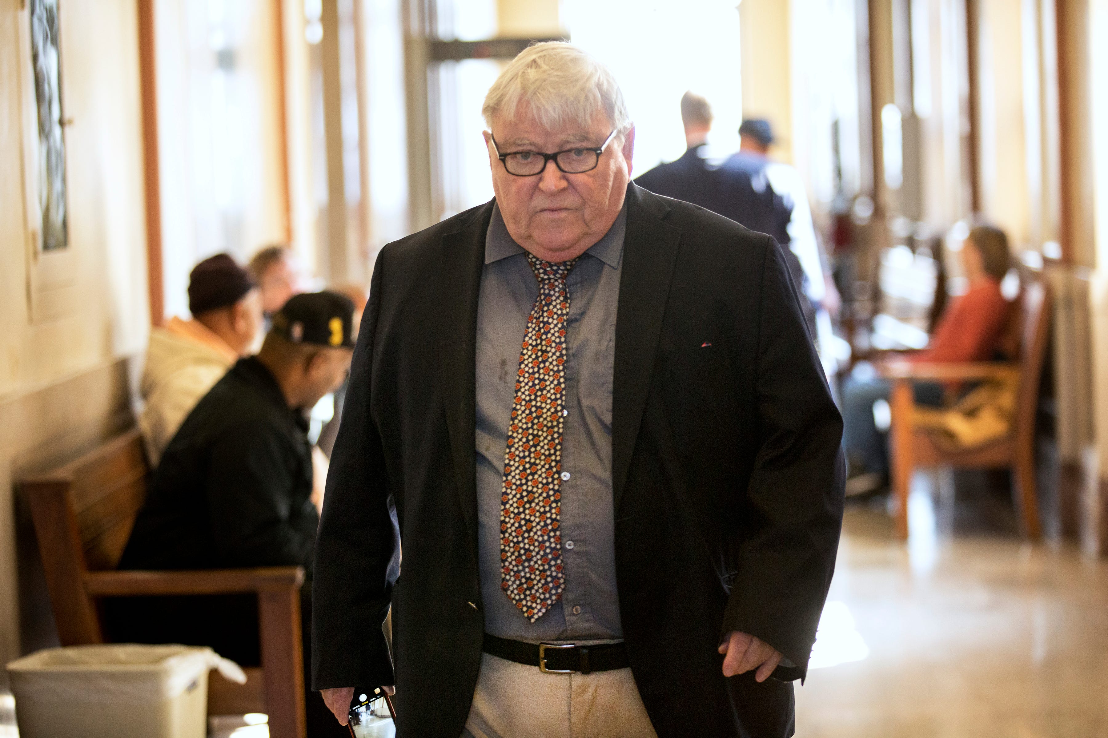 Mearan walks through the hallways of the Scioto County Courthouse before a hearing for one of his clients. Mearan was named in a federal affidavit outlining a drug and sex trafficking operation in 2015, but no charges were ever brought.