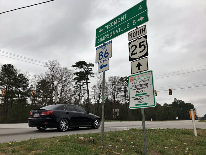 Vehicles pass through the intersection of Augusta Road and Sandy Springs Road outside Piedmont in southern Greenville County on Sunday, March 3, 2019. Developers plan to build and market the South Greenville Enterprise Park nearby.