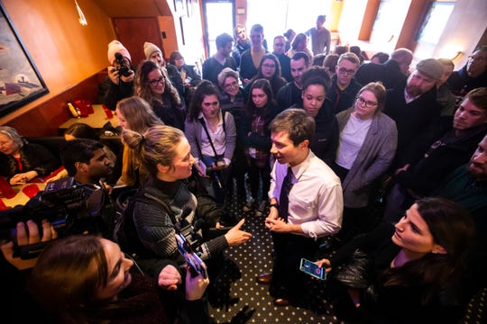 Pete Buttigieg, Mayor of South Bend, Ind. and 2020 Democratic presidential candidate, talks with Daily Iowan reporter Sarah Watson during an event on Monday, March 4, 2019, at The Airliner in downtown Iowa City, Iowa.