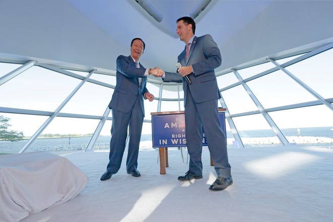 Foxconn Chairman Terry Gou (left) and Gov. Scott Walker shake hands during a July 27, 2017, ceremony at the Milwaukee Art Museum, where they signed a memorandum of understanding outlining Foxconn's agreement with Wisconsin.