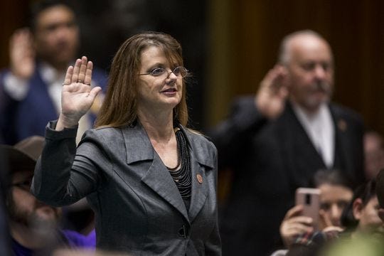 Rep. Kelly Townsend takes the oath of office with legislators during Opening Day of the Legislature on Jan. 14, 2019, at the Arizona House of Representatives Chambers in Phoenix.
