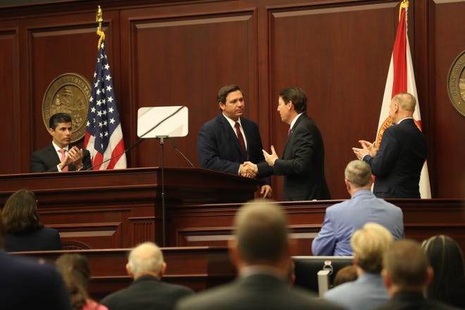 Gov. Ron DeSantis shakes hands with Senate President Bill Galvano after giving his State of the State address during the opening day of session for the Florida Legislature Tuesday, March 5, 2019. 