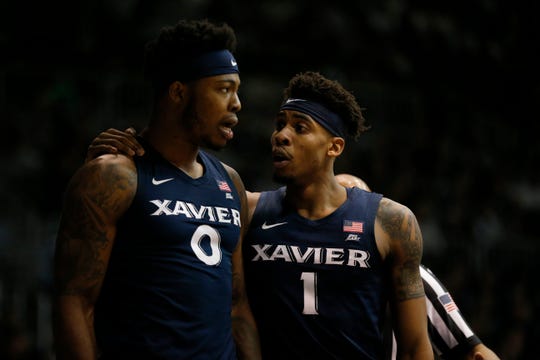 Xavier Musketeers forward Tyrique Jones (0) is calmed by Xavier Musketeers guard Paul Scruggs (1) in the second half of the NCAA Big East basketball game between the Butler Bulldogs and the Xavier Musketeers at Hinkle Fieldhouse in Indianapolis, Ind., on Tuesday, March 5, 2019. Xavier's winning streak ended with a 71-66 loss to Butler. 
