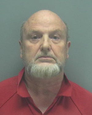 Authorities arrested William Robert Burkey Monday on child porn charges.