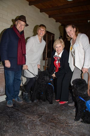 (left to right) Event host Steve Maloney, Guide Dogs of the Desert puppy raiser Judy Northrup with guide dog Shadoe, event host Yvonne Maloney, Angel Coleman with guide dog Clark, Guide Dogs of the Desert breeding/medical manager with guide dog Sarah.