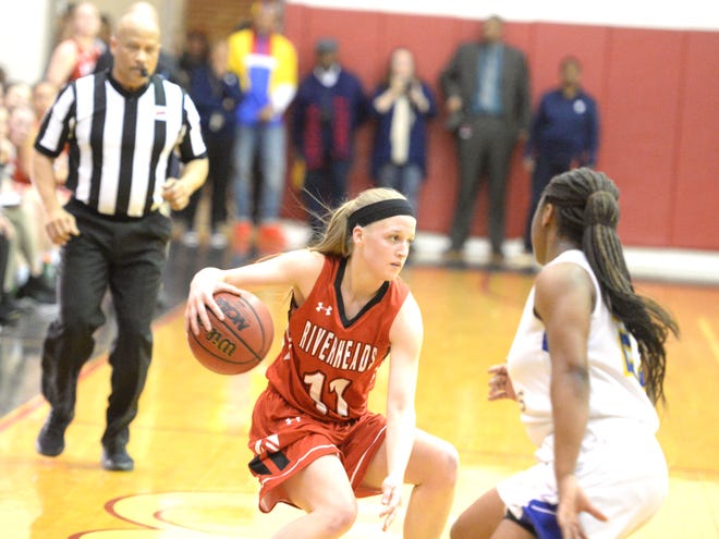 Riverheads' Sara Moore tries to find a way around the Surry County defender Tuesday in the Class 1 girls basketball state semifinals.