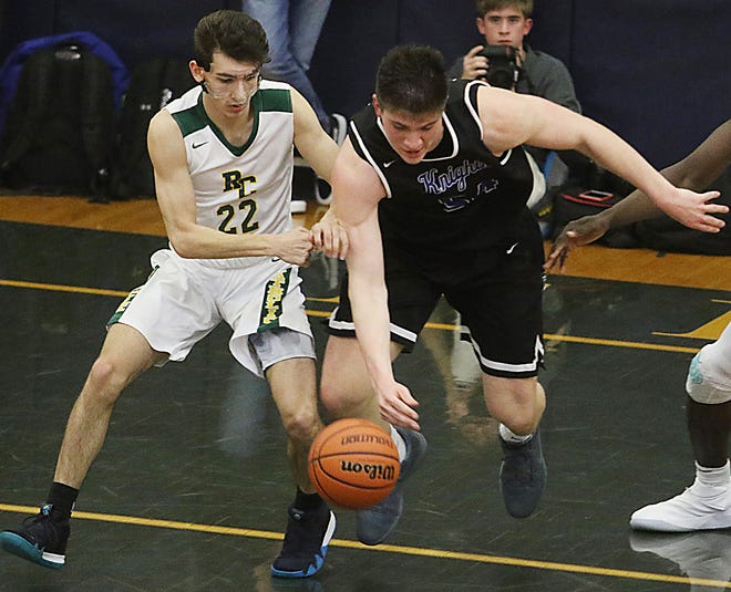Richie Greaves of Roselle Catholic goes for the ball with Zach Martini of GSB in the first half. 