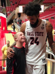 FILE -- Trey Moses greets Luke Vormohr after a Ball State basketball game.