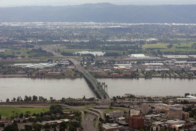 Interstate 5 crosses the Columbia River and Hayden Island as it heads from Vancouver, Wash., bottom, toward Portland, Ore.