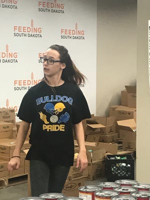 Baltic student Braelyn Youngs volunteers at Feeding South Dakota in Sioux Falls on Tuesday, Feb. 26.