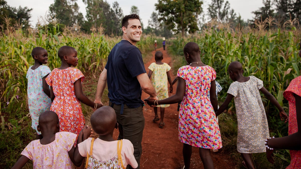 Detroit Tigers pitcher Matthew Boyd smiles as he walks through a cornfield in Uganda, where the Boyds have opened a non-profit aimed at ending child sex slavery.