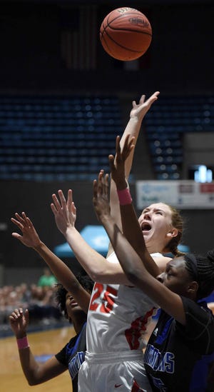 Pine Grove's Loren Elliott (25) shoots in a sea of arms against Simmons in the finals of the MHSAA C Spire State Basketball Championships at the Mississippi Coliseum in Jackson, Miss., on Thursday, March 7, 2019.