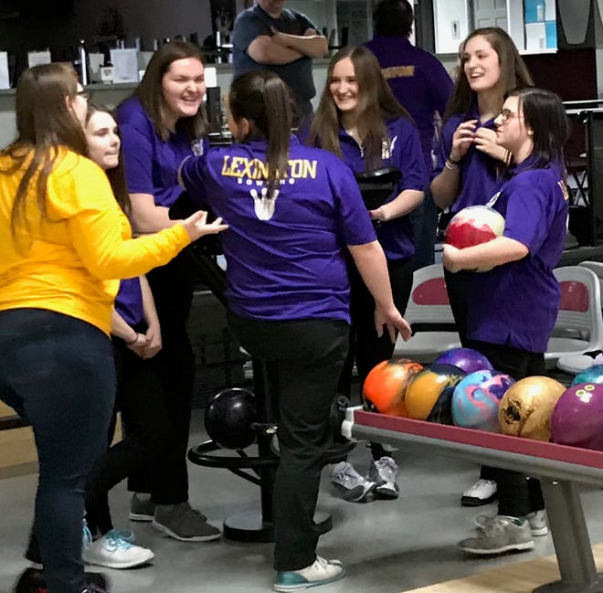 The girls on the Lexington bowling team do a little bonding during practice this week at Lex Lanes before going on to finish ninth in the Division I field at the state tournament in Columbus.