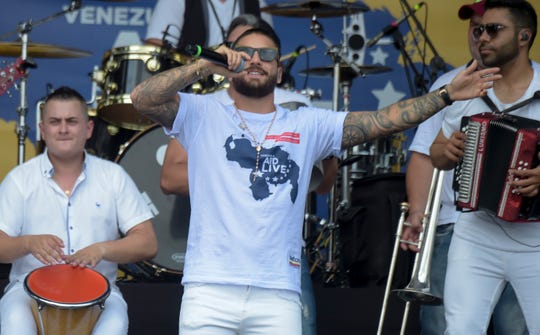 Colombian singer Maluma performs at the Venezuela Aid Live concert, organized to raise money for the Venezuelan relief effort at the head of the Tienditas International Bridge in Cucuta, Colombia, on February 22, 2019.