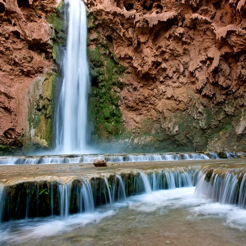 Water flows from Mooney Falls, one of the the Hava