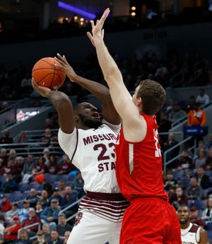 Missouri State's Kabir Mohammed (23) puts up a shot under pressure from Bradley, Friday, March 8, 2019, at the Enterprise Center in St. Louis.