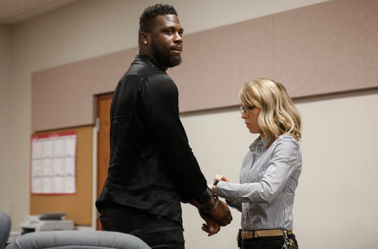 Dorial Green-Beckham is handcuffed by a bailiff after he was sentenced to 90 days in jail for probation violation in a prior DWI case on Friday, March 8, 2019.
