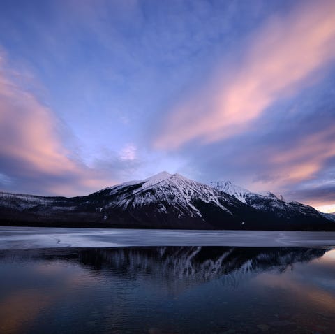 A snowy sunrise over Lake McDonald in Glacier Nati