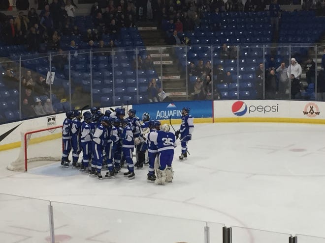 Catholic Central celebrates advancing to the state final after beating Rochester on March 8 in Plymouth, MI.