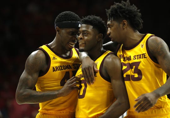 ASU's Romello White (23) and Zylan Cheatham (45) grab Luguentz Dort (0) after he was called for a technical foul during the first half at the McKale Memorial Center in Tucson, Ariz. on March 9, 2019.