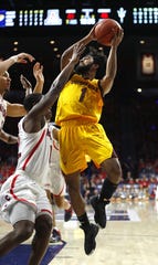 Remy Martin makes a layup against Justin Coleman during Saturday's ASU win at McKale Center.