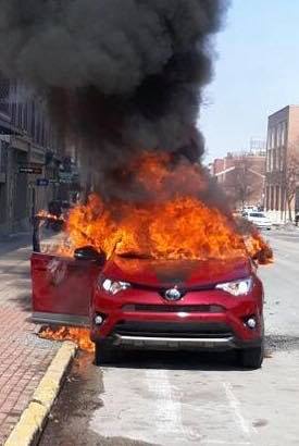 Residents helped rescue a man from a burning car on the corner of Market Street and George Street in York City on Saturday March 9, according to the fire department (Photo courtesy of the York City Fire Department).