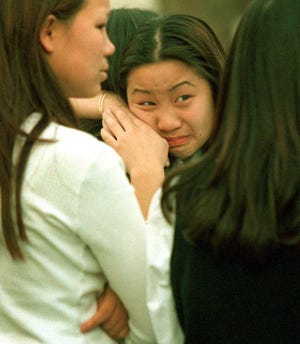 Nancy Saechao's relatives weep during the 2001 sentencing of Samuel Espinoza, who was convicted of killing the 13-year-old Visalia middle school student.
