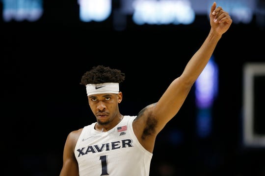 Xavier Musketeers guard Paul Scruggs (1) calls on the crowd in the final minutes of the second half of the NCAA Big East game between the Xavier Musketeers and the St. John's Red Storm at the Cintas Center in Cincinnati on Saturday, March 9, 2019. Xavier won its final game of the regular season, 81-68.
