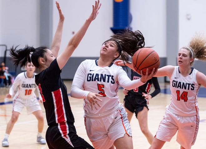 COS' Janelle Sumilong goes for two against San Francisco City College's Rika Baba in a NorCal quarterfinal junior college basketball state playoff game on Saturday, March 9, 2019.